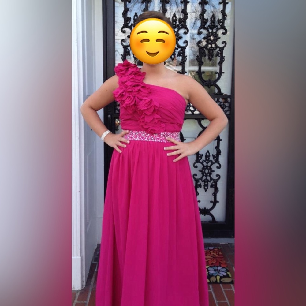 Hot pink, one shoulder prom dress with a rhinestone waistband.